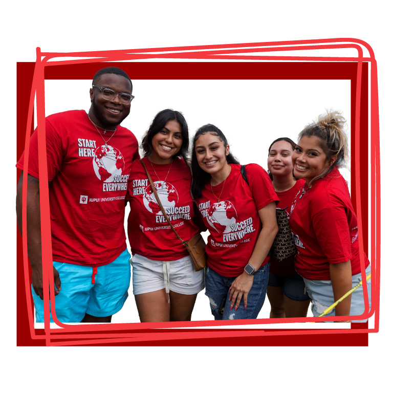 Four students posing for a photo during a team activity.