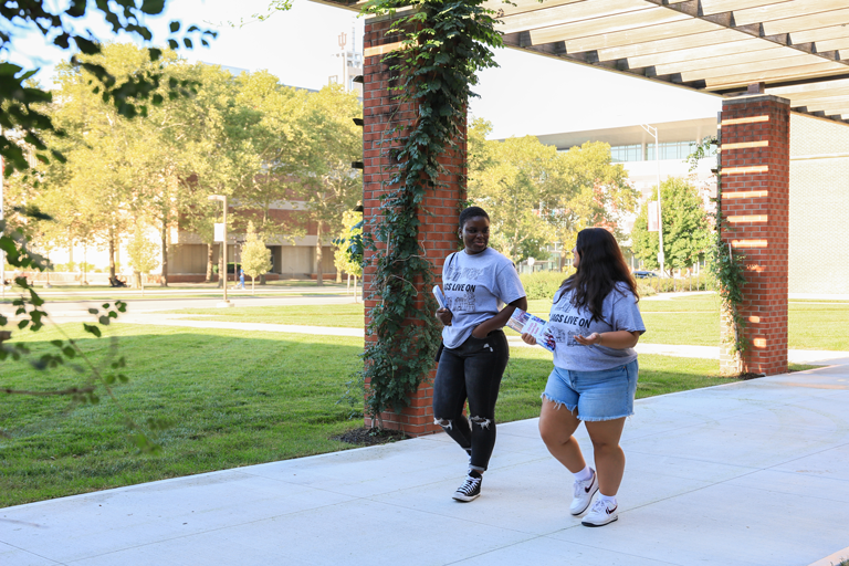 Two RAs walking and talking.
