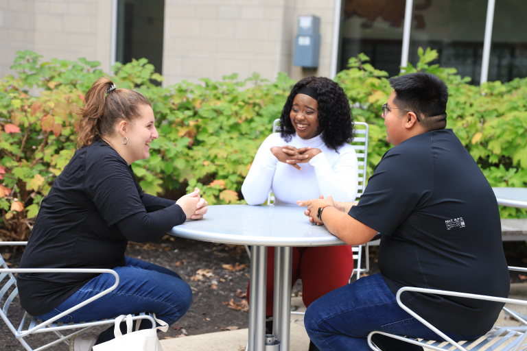 Students hanging out by North Hall.