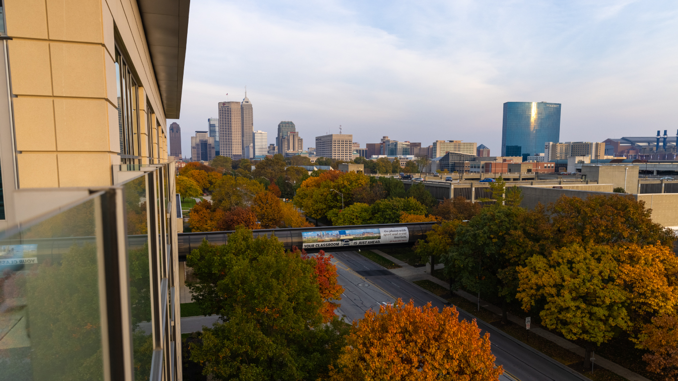 Two students at the fountain talking.